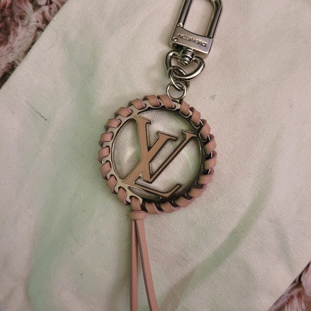 $325 EMT Louis Vuitton pink very bag charm. Classic LV logo